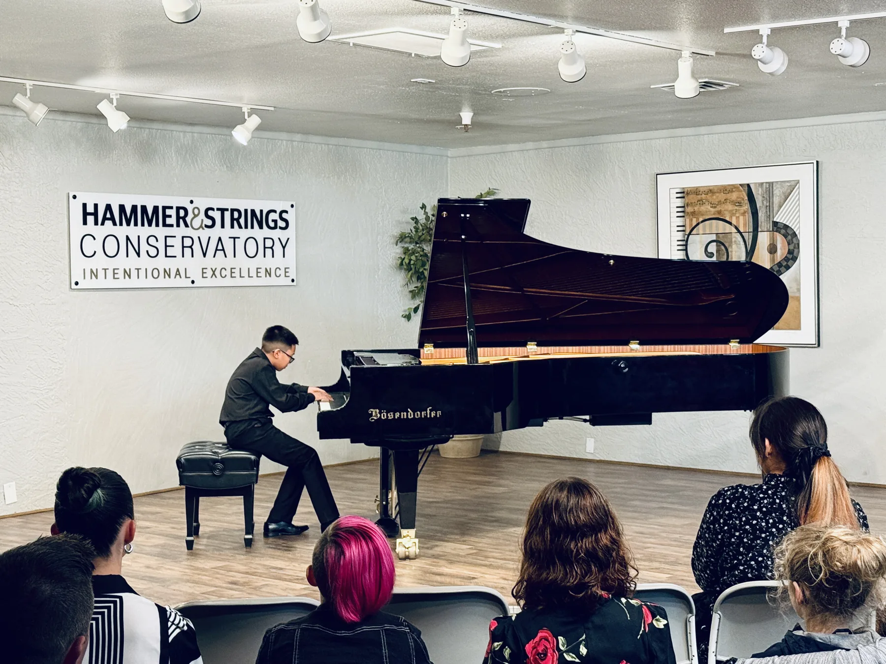 Anthony Tran at the piano, mid-performance of Liszt's Mephisto Waltz.