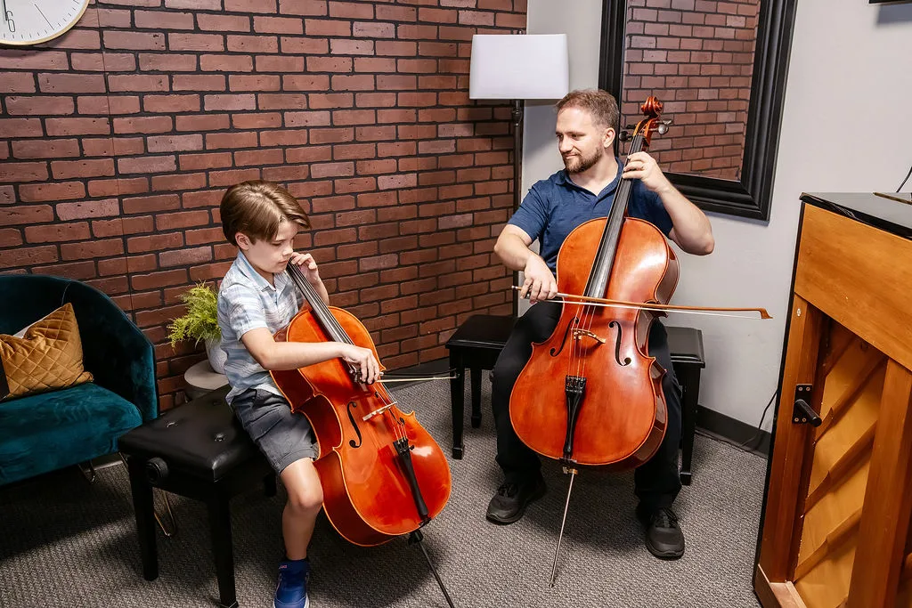 A cello lesson in progress with an H&S teacher.