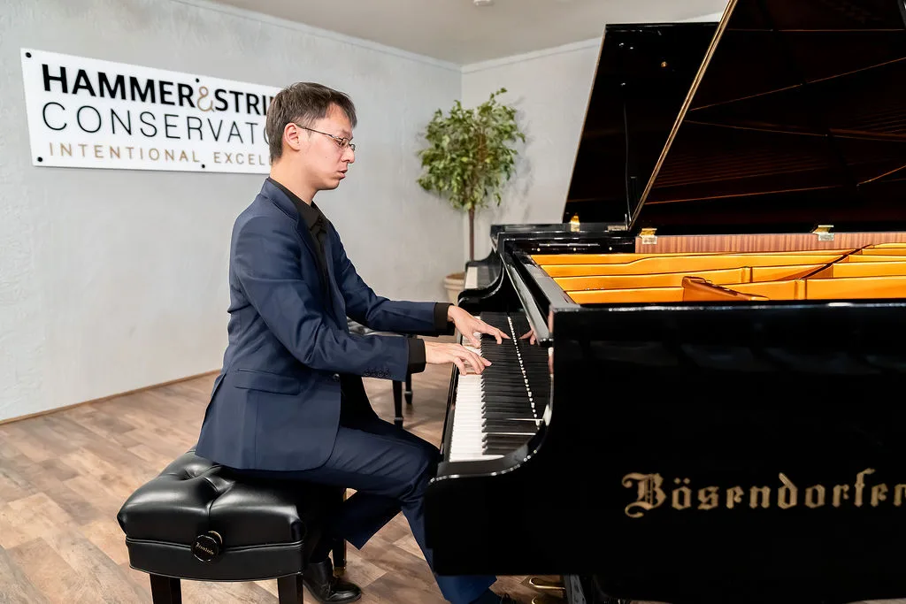 A pianist performing on the Conservatory Bosendorfer grand.