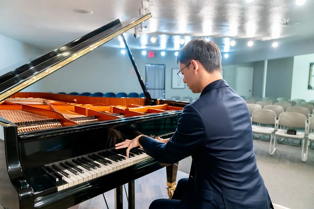 A pianist rehearsing in the Conservatory recital hall.