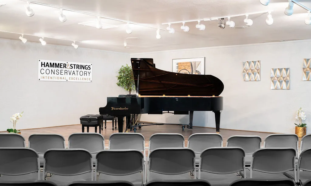 The Liszt Recital Hall stage and Bosendorfer grand, set for a recital.