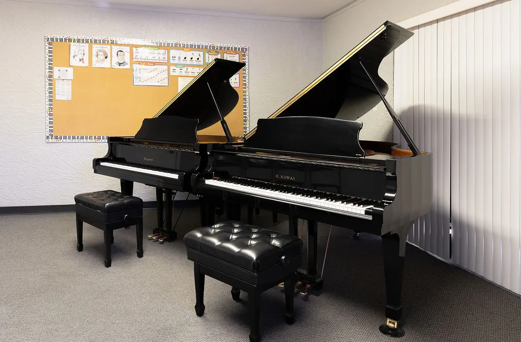 A Conservatory practice room with two grand pianos.