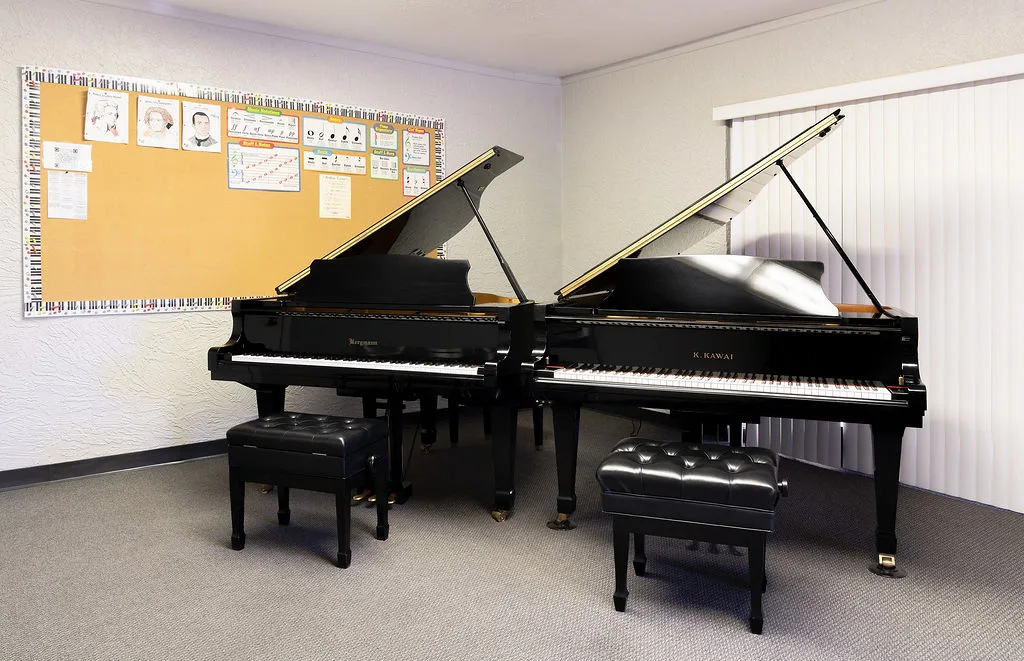 A Conservatory practice room with two grand pianos.